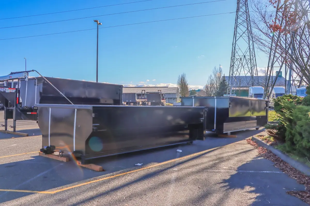 Roll-off dumpster ready for waste disposal at job site for Demolition Dumpster Rental in Stansbury Park